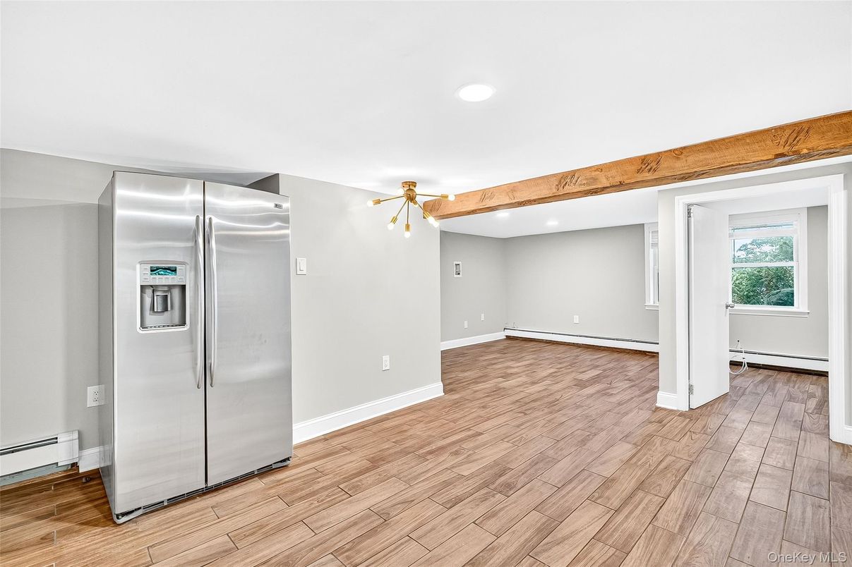 Empty room, Interior, Kitchen, Recessed Lighting, Stainless Steel Appliances, Wooden Beams, Wood Texture Flooring