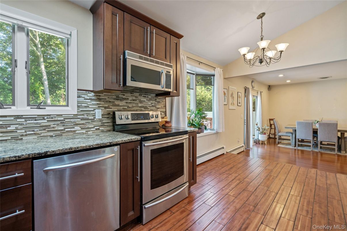 Chandelier, Dining room, Interior, Kitchen, Recessed Lighting, Stainless Steel Appliances, Wood Texture Flooring