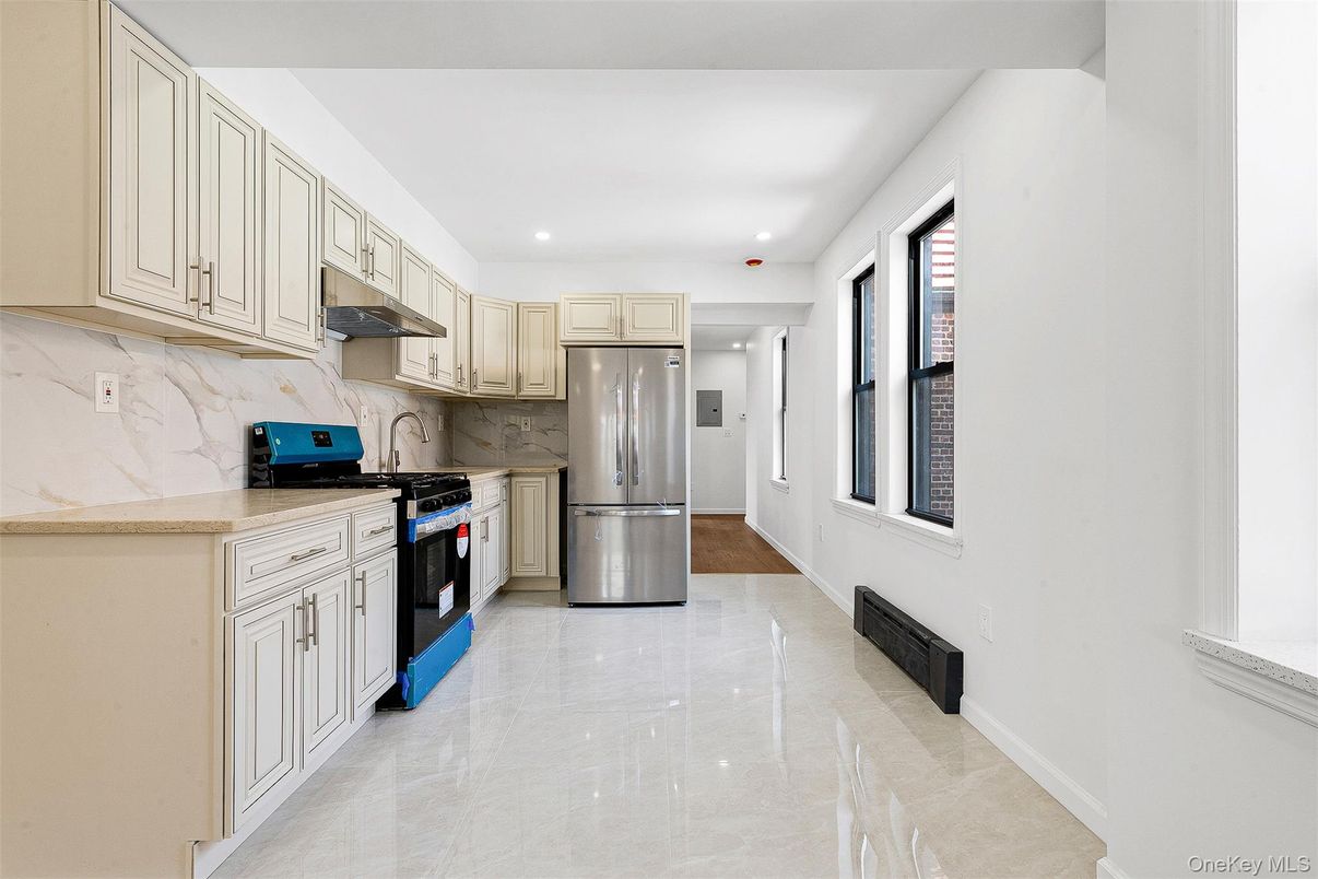 Interior, Kitchen, Marble Walls, Recessed Lighting, Stainless Steel Appliances