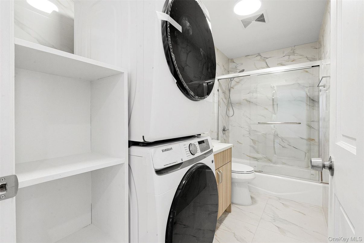 Bathroom, Glass Shower, Interior, Marble, Marble Walls, Recessed Lighting, Washer