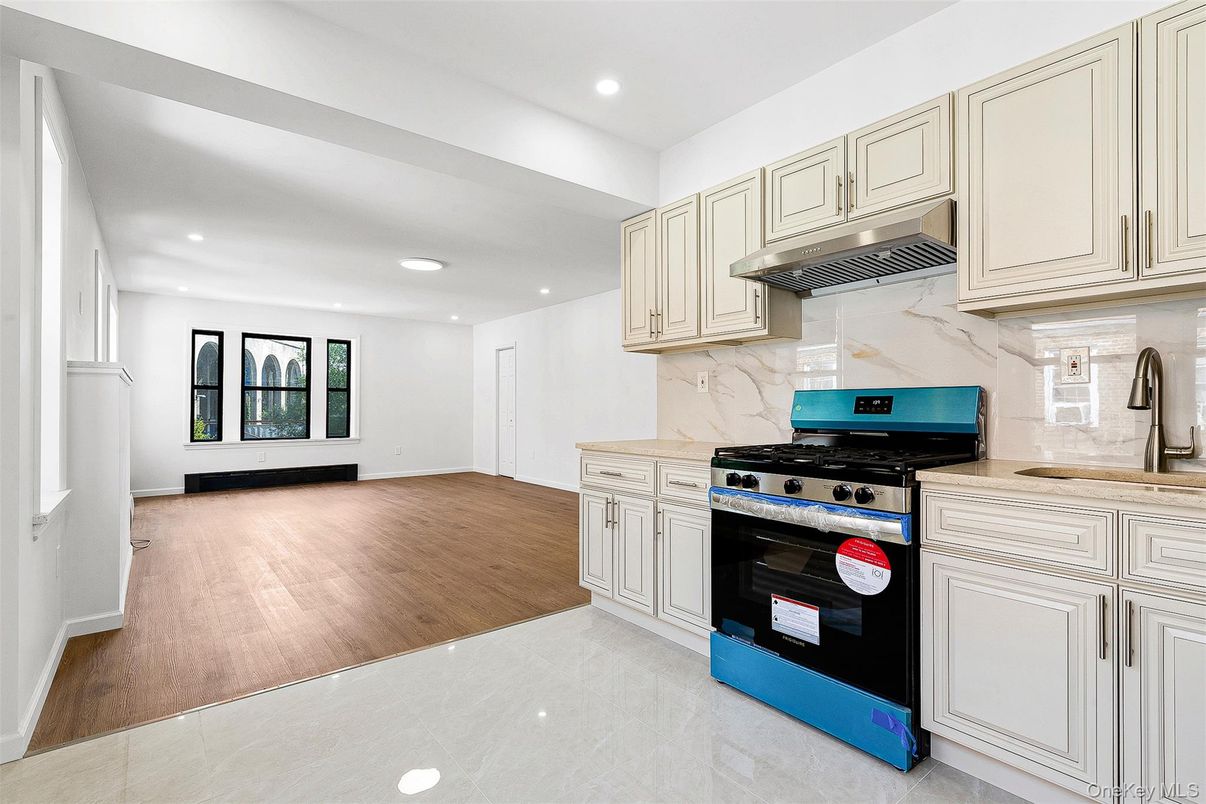 Interior, Kitchen, Marble Walls, Recessed Lighting, Stainless Steel Appliances, Wood Texture Flooring