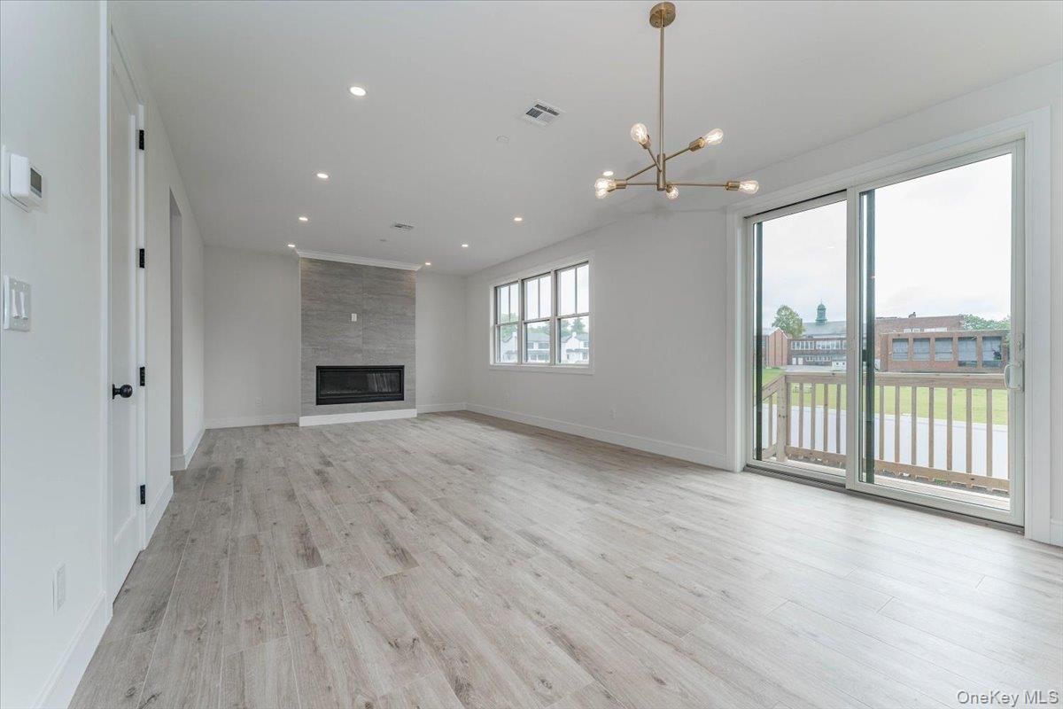 Empty room, Fireplace, Interior, Pendant Lights, Recessed Lighting, Wood Texture Flooring