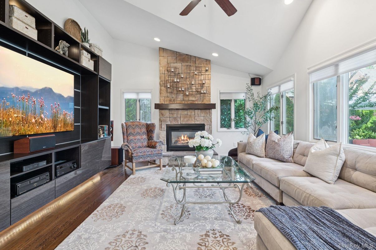 Fireplace, Interior, Living room, Recessed Lighting, Stone Walls, Wood Texture Flooring