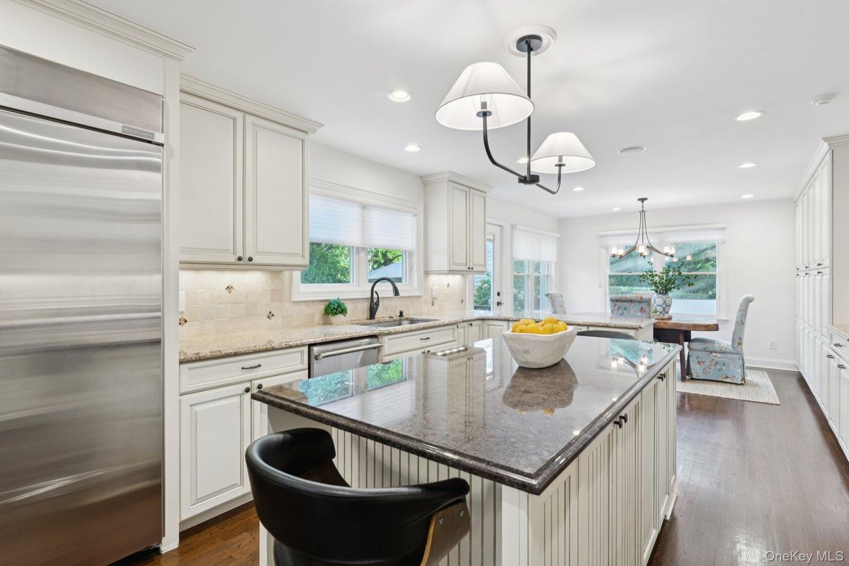 Chandelier, Dining room, Interior, Kitchen, Pendant Lights, Recessed Lighting, Stainless Steel Appliances, Wood Texture Flooring