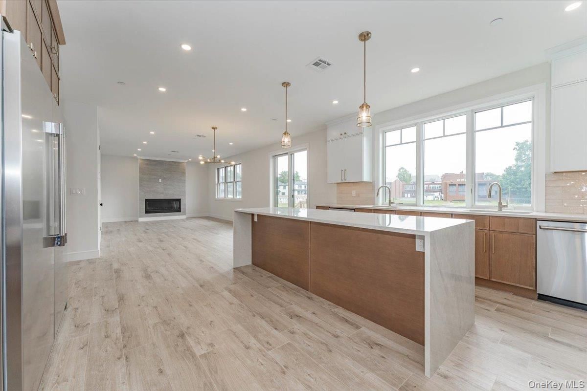 Fireplace, Interior, Kitchen, Pendant Lights, Recessed Lighting, Stainless Steel Appliances, Wood Texture Flooring