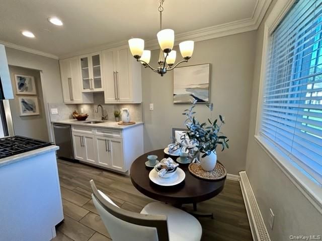 Chandelier, Dining room, Interior, Kitchen, Recessed Lighting, Stainless Steel Appliances, Wood Texture Flooring