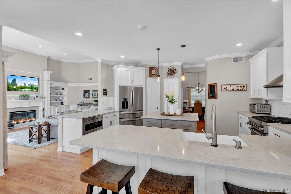 Fireplace, Interior, Kitchen, Pendant Lights, Recessed Lighting, Stainless Steel Appliances, Wood Texture Flooring