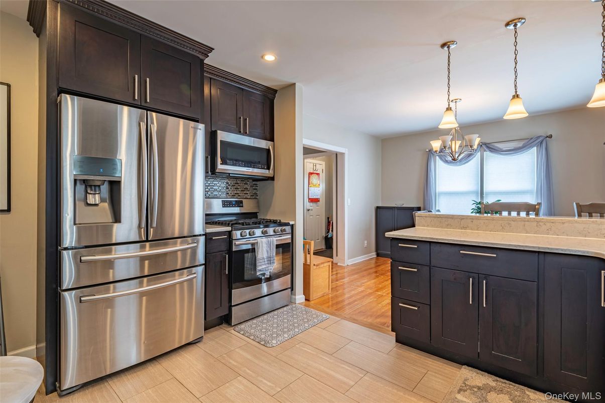 Chandelier, Interior, Kitchen, Pendant Lights, Recessed Lighting, Stainless Steel Appliances, Wood Texture Flooring