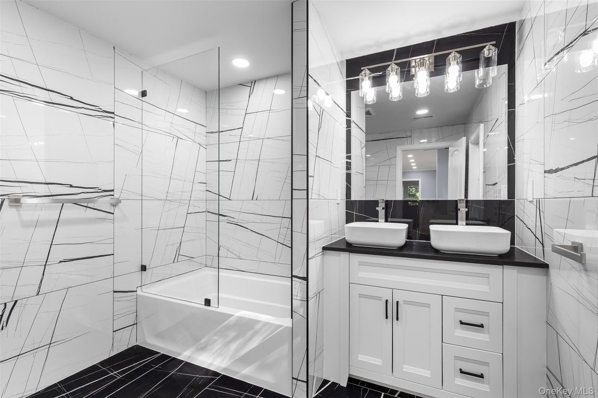 Bathroom, Dual Sink Vanities, Glass Shower, Interior, Marble Walls, Recessed Lighting