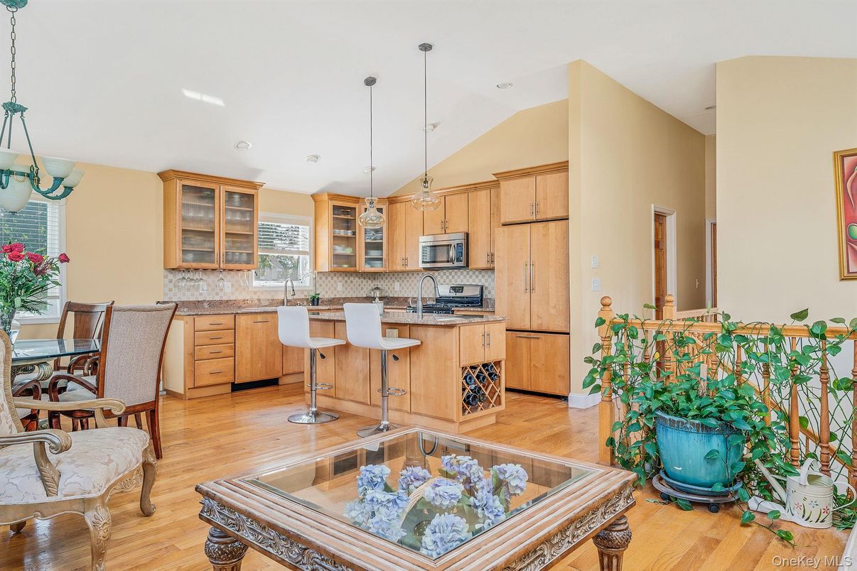 Dining room, Interior, Kitchen, Pendant Lights, Recessed Lighting, Stainless Steel Appliances, Wood Texture Flooring