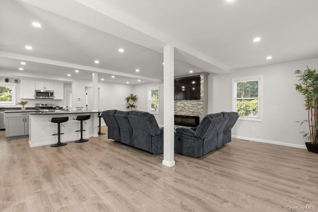 Fireplace, Interior, Kitchen, Living room, Recessed Lighting, Stainless Steel Appliances, Wood Texture Flooring