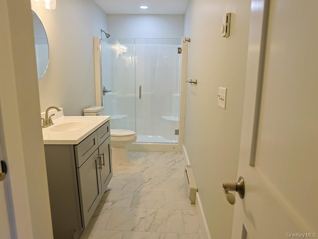 Bathroom, Dual Sink Vanities, Glass Shower, Interior, Marble, Recessed Lighting