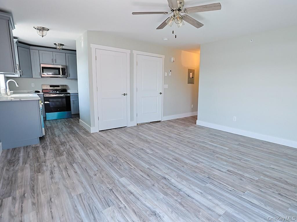 Empty room, Interior, Kitchen, Stainless Steel Appliances, Wood Texture Flooring