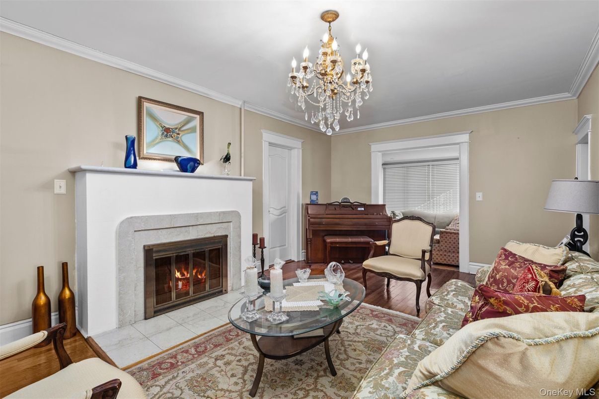 Chandelier, Fireplace, Interior, Living room, Piano, Wood Texture Flooring