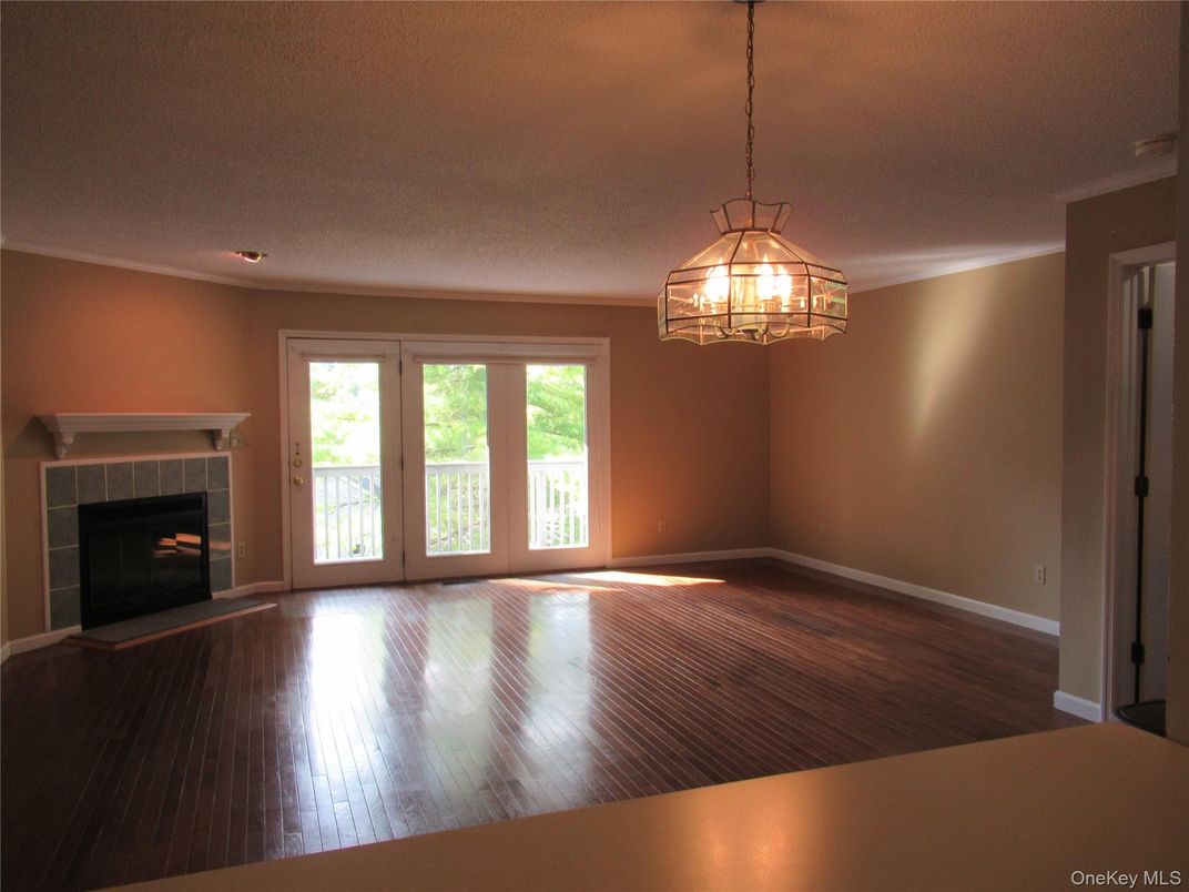 Chandelier, Empty room, Fireplace, Interior, Pendant Lights, Wood Texture Flooring