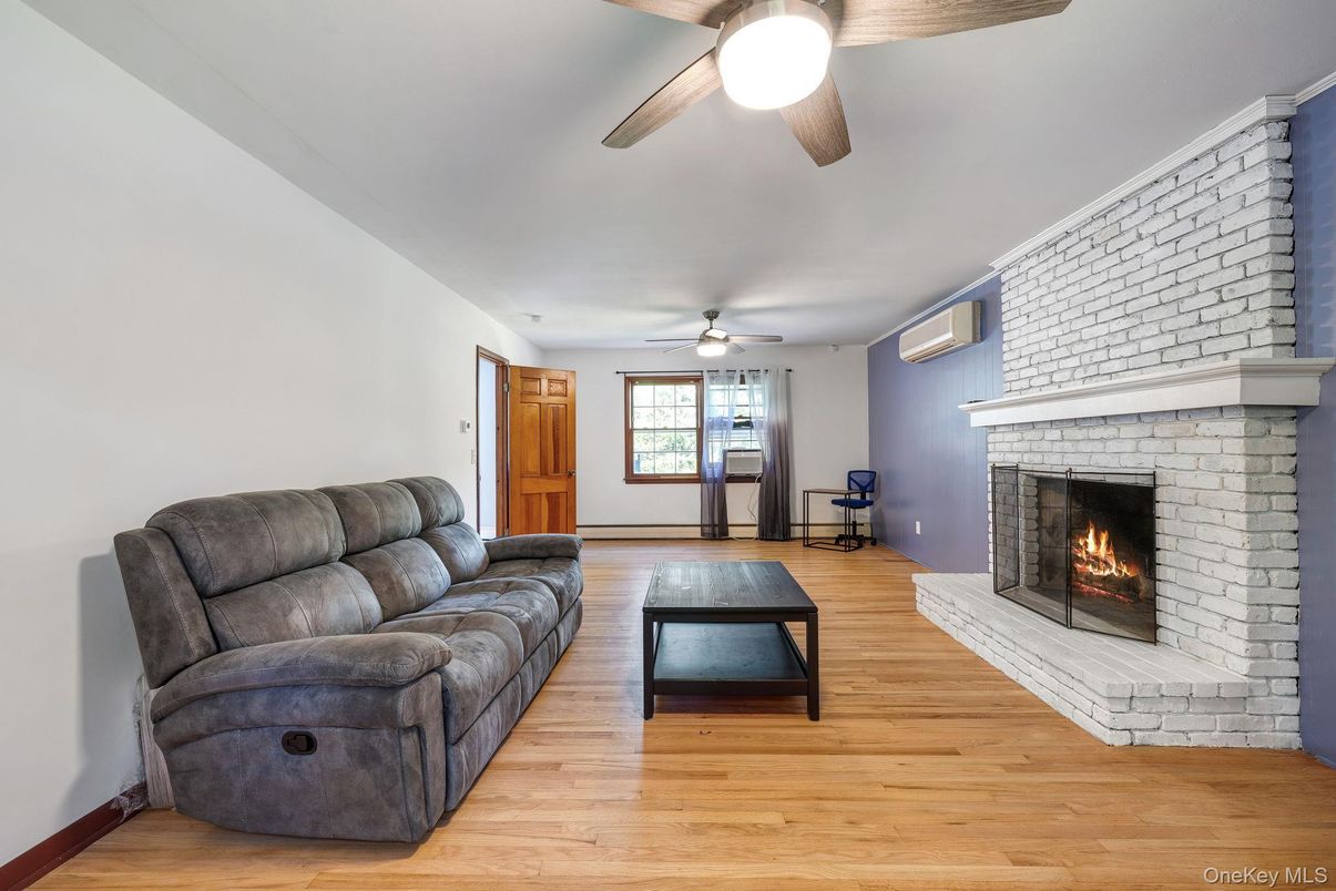 Fireplace, Fitness Equipment, Interior, Living room, Stone Walls, Wood Texture Flooring