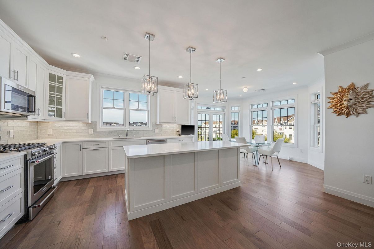 Dining room, Interior, Kitchen, Pendant Lights, Recessed Lighting, Stainless Steel Appliances, Wood Texture Flooring