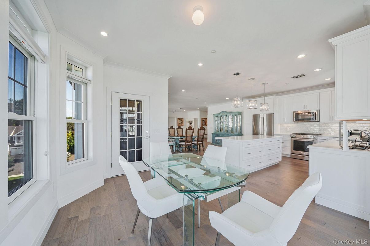 Dining room, Interior, Kitchen, Pendant Lights, Recessed Lighting, Stainless Steel Appliances, Wood Texture Flooring