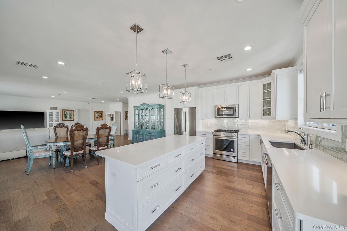 Dining room, Interior, Kitchen, Pendant Lights, Recessed Lighting, Stainless Steel Appliances, Wood Texture Flooring