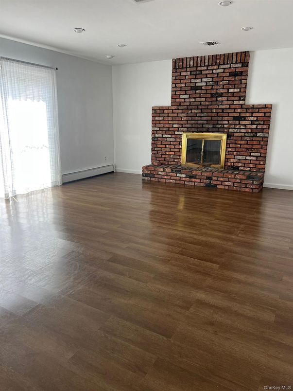 Empty room, Fireplace, Interior, Recessed Lighting, Stone Walls, Wood Texture Flooring