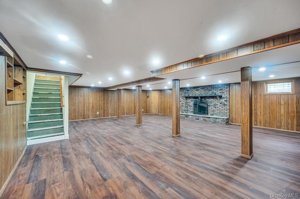 Empty room, Fireplace, Interior, Recessed Lighting, Stone Walls, Wood Texture Flooring, Wooden Walls