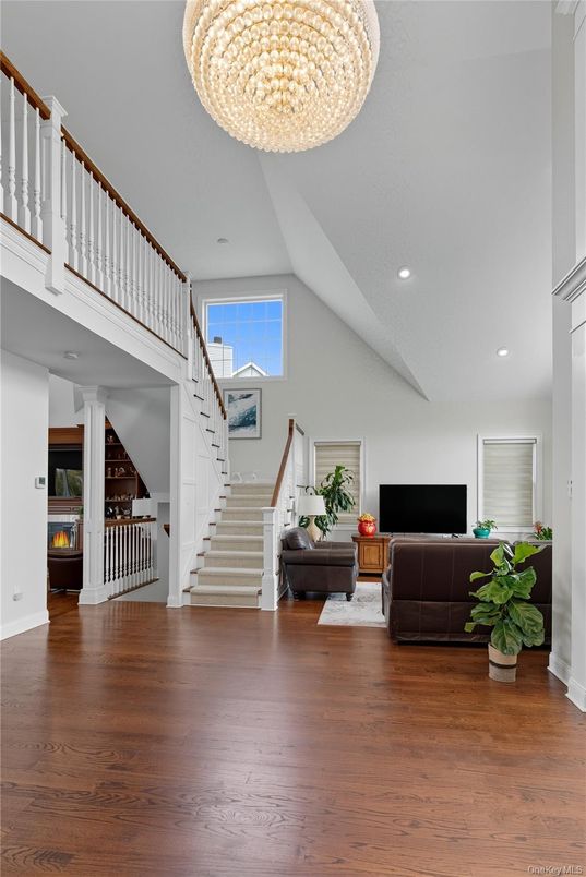 Chandelier, Fireplace, Interior, Living room, Recessed Lighting, Wood Texture Flooring