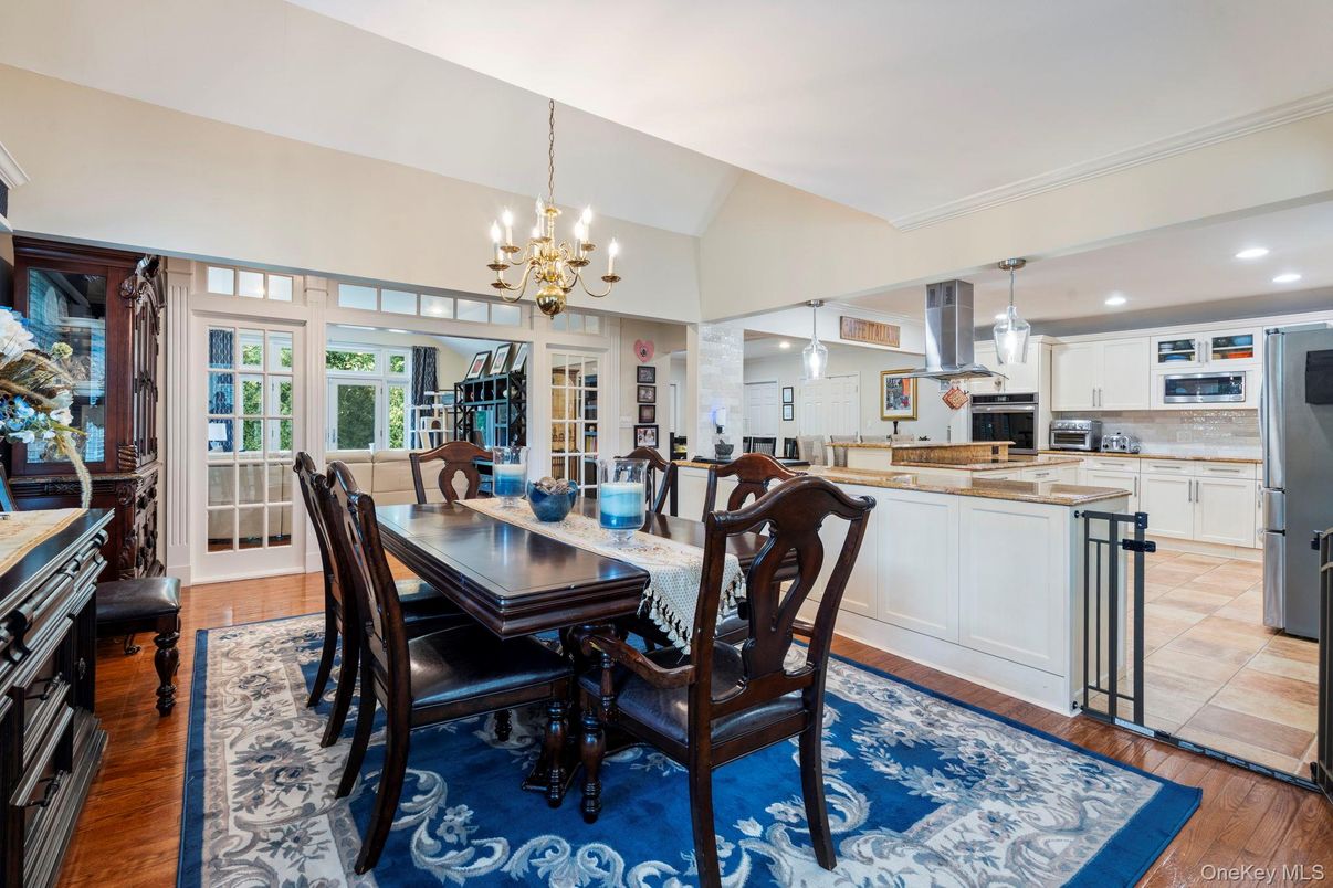 Chandelier, Dining room, Interior, Kitchen, Pendant Lights, Recessed Lighting, Stainless Steel Appliances, Wood Texture Flooring