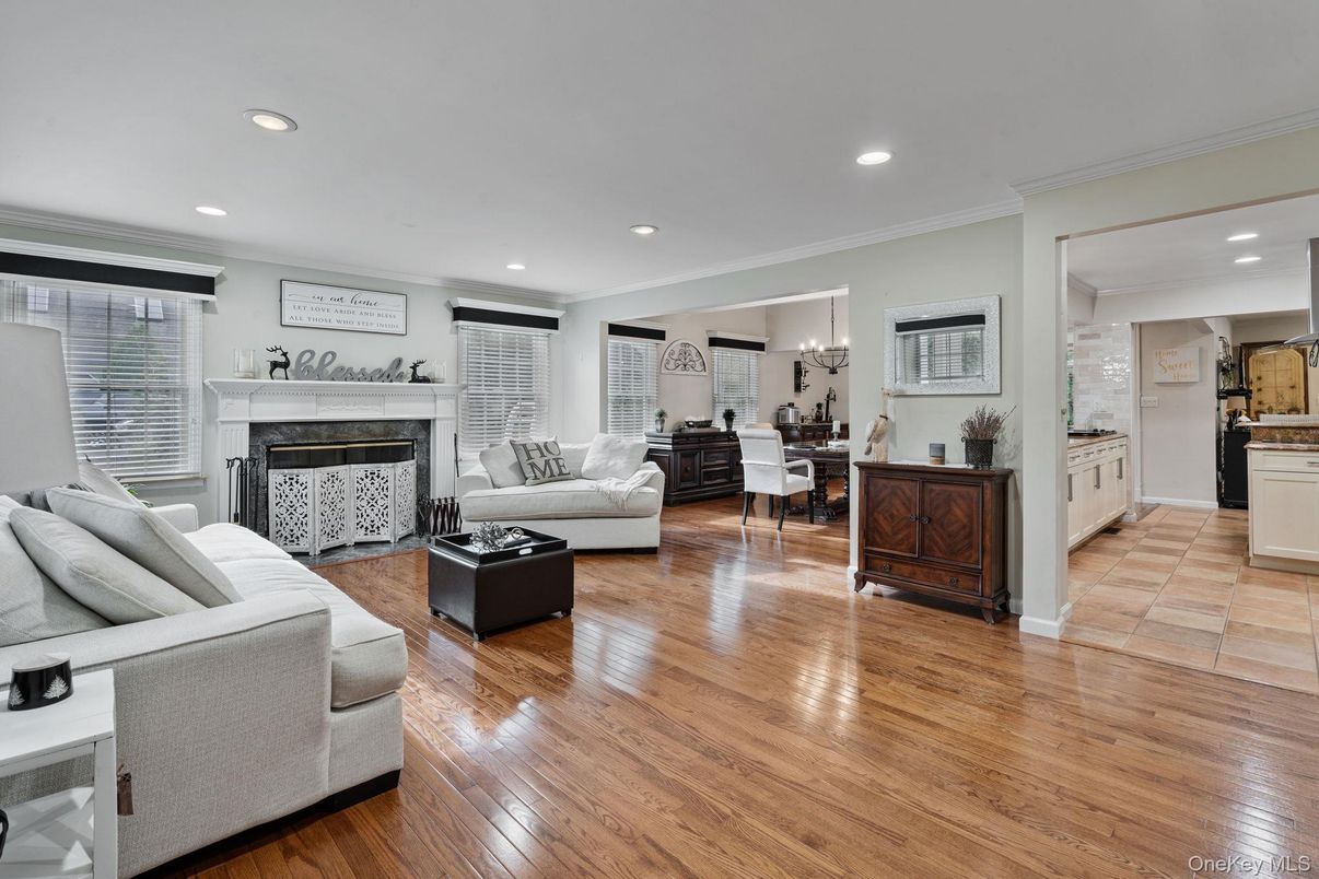 Chandelier, Dining room, Fireplace, Interior, Living room, Recessed Lighting, Wood Texture Flooring