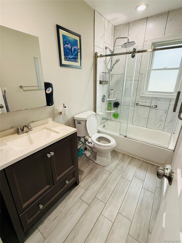Bathroom, Glass Shower, Interior, Marble Walls, Recessed Lighting, Wood Texture Flooring
