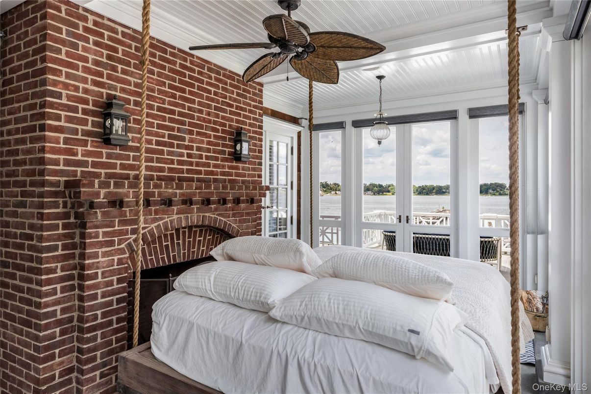 Bedroom, Fireplace, Interior, Pendant Lights, Stone Walls, Water