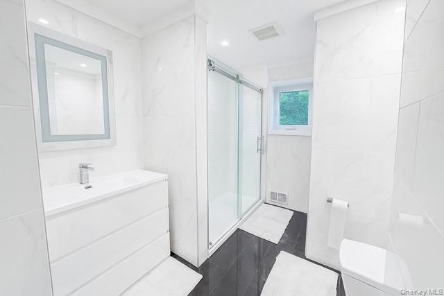 Bathroom, Glass Shower, Interior, Marble Walls, Recessed Lighting, Wood Texture Flooring