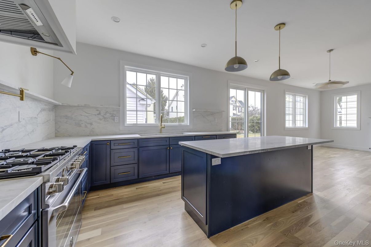 Interior, Kitchen, Marble Walls, Pendant Lights, Recessed Lighting, Stainless Steel Appliances, Wood Texture Flooring