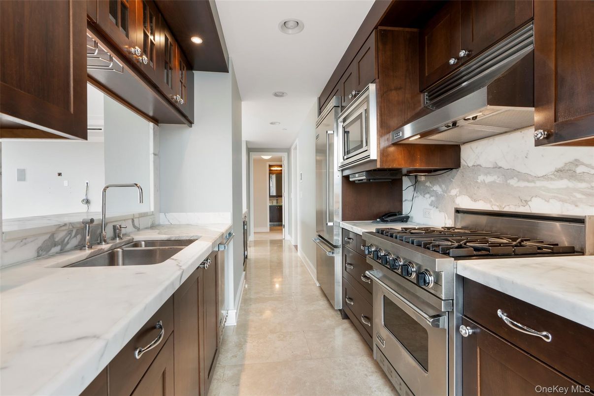 Interior, Kitchen, Marble Walls, Recessed Lighting, Stainless Steel Appliances