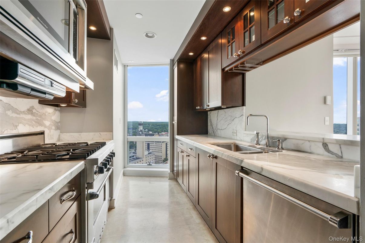 Interior, Kitchen, Marble Walls, Recessed Lighting, Stainless Steel Appliances