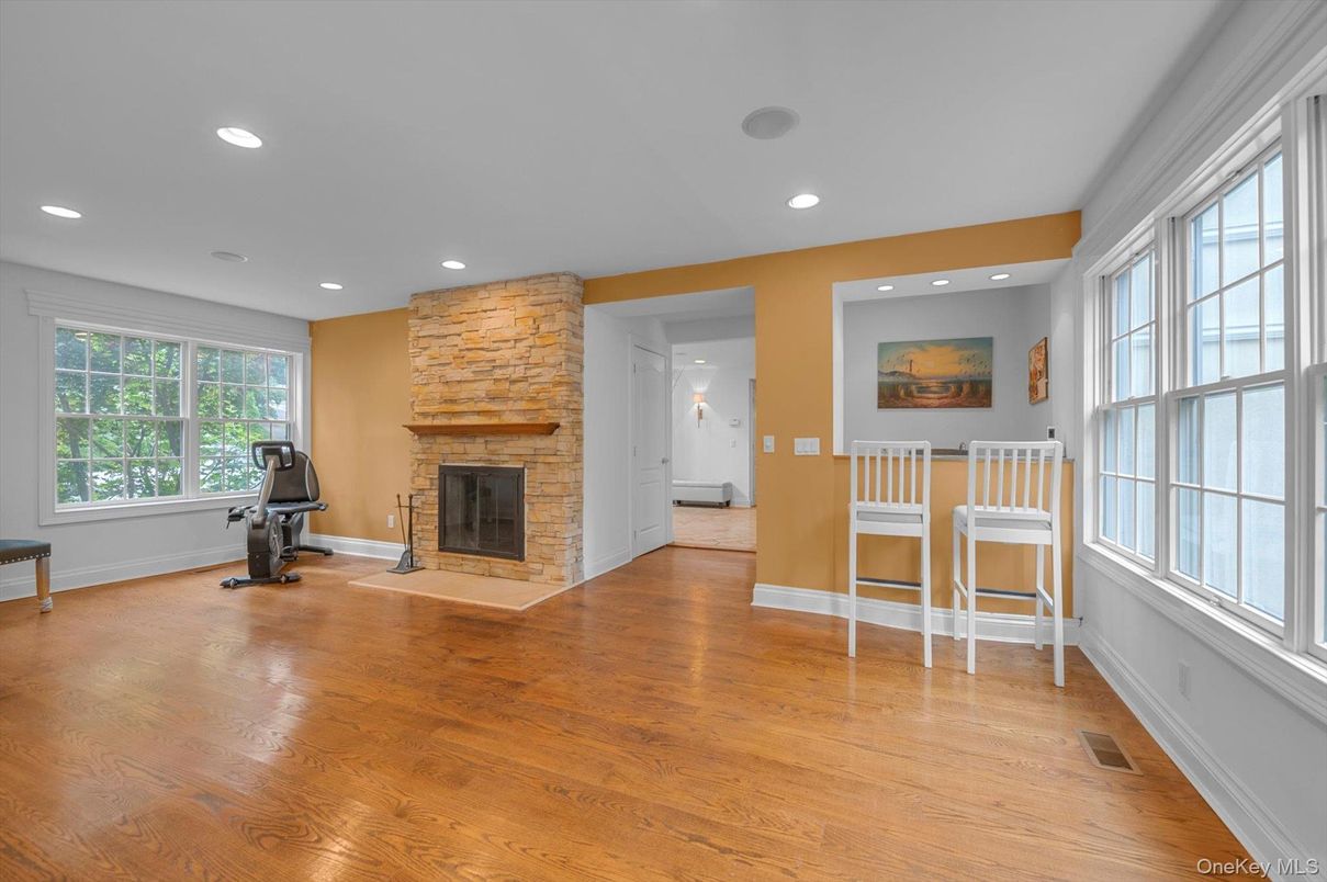 Fireplace, Fitness Equipment, Interior, Recessed Lighting, Wood Texture Flooring