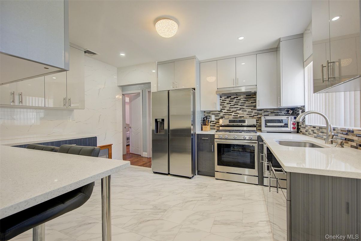 Interior, Kitchen, Marble, Marble Walls, Recessed Lighting, Stainless Steel Appliances