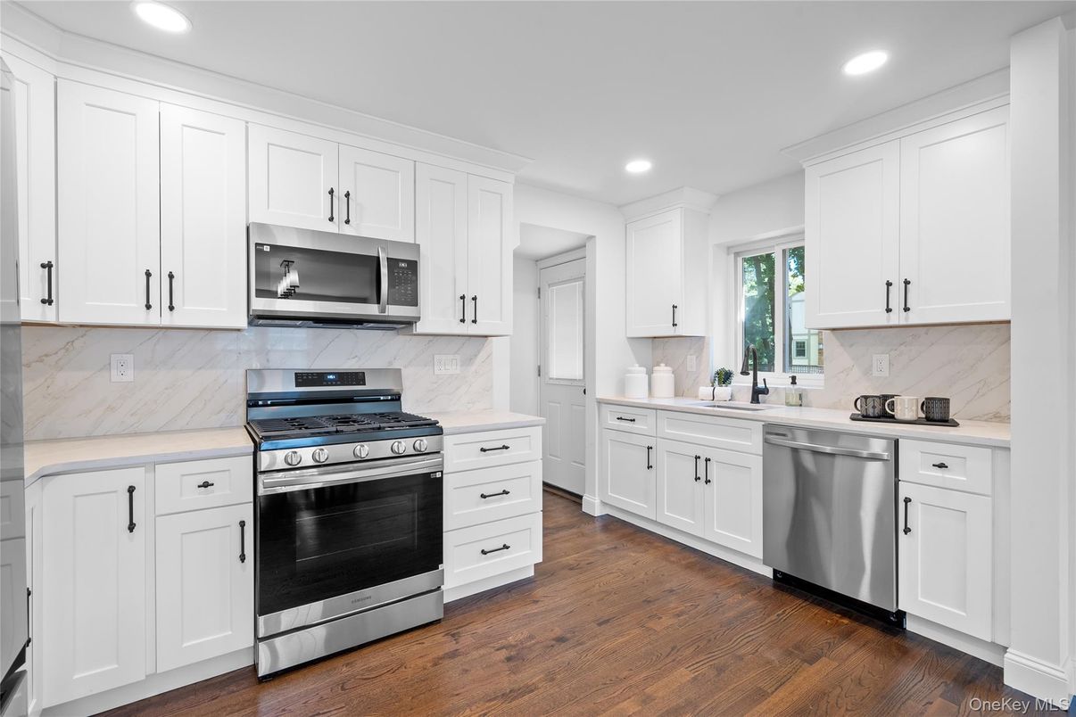 Interior, Kitchen, Marble Walls, Recessed Lighting, Stainless Steel Appliances, Wood Texture Flooring