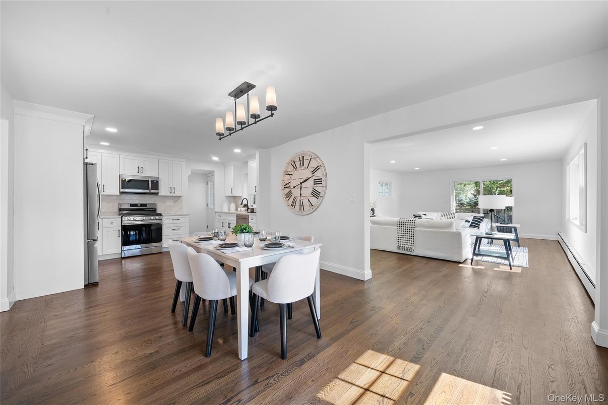 Chandelier, Dining room, Interior, Kitchen, Living room, Recessed Lighting, Stainless Steel Appliances, Wood Texture Flooring