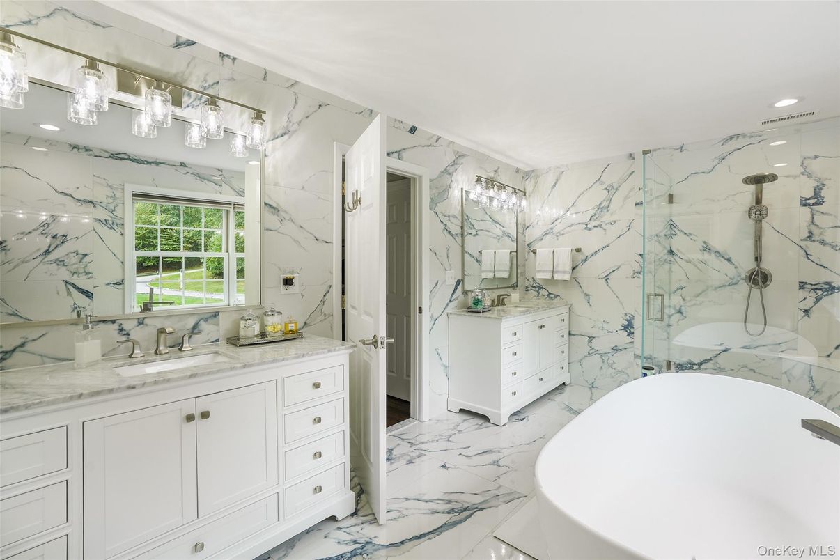 Bathroom, Dual Sink Vanities, Free Standing Baths, Glass Shower, Interior, Marble, Marble Walls, Recessed Lighting