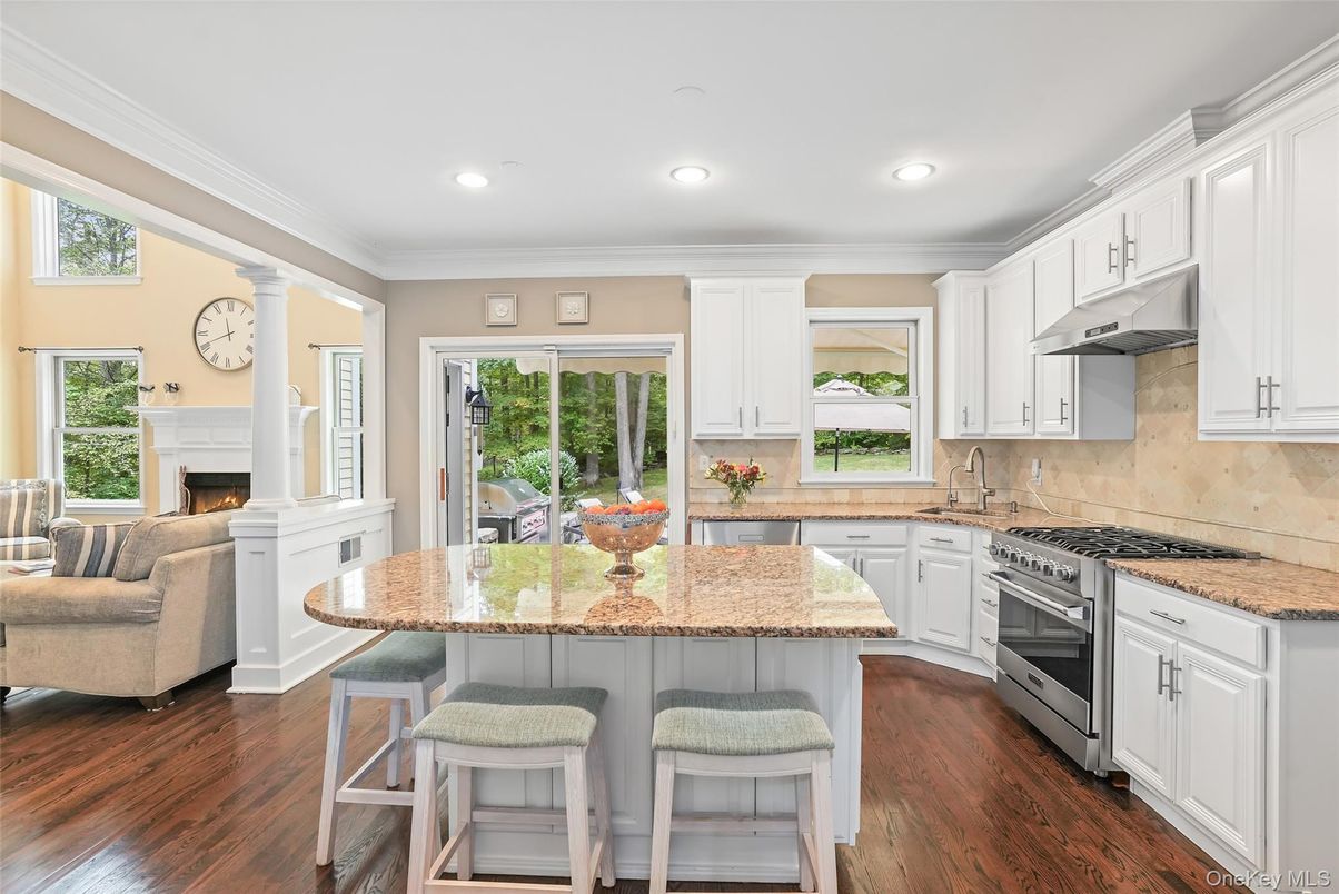 Fireplace, Interior, Kitchen, Living room, Recessed Lighting, Stainless Steel Appliances, Wood Texture Flooring