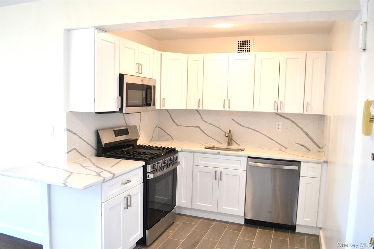 Interior, Kitchen, Marble Walls, Stainless Steel Appliances, Wood Texture Flooring