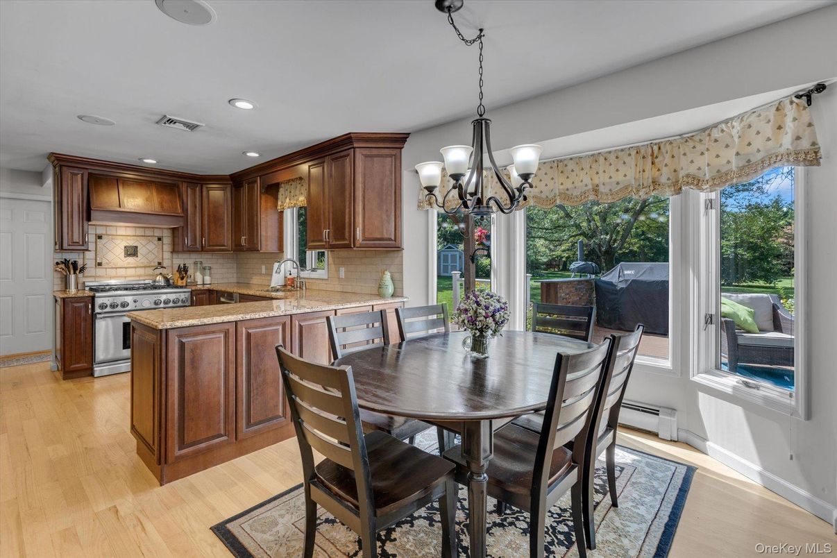 Chandelier, Dining room, Interior, Kitchen, Recessed Lighting, Stainless Steel Appliances, Wood Texture Flooring
