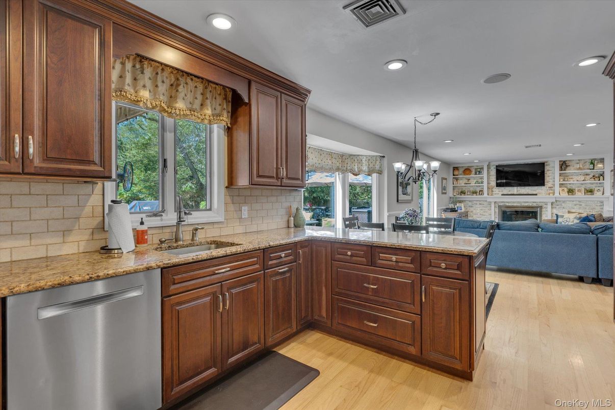 Chandelier, Dining room, Fireplace, Interior, Kitchen, Living room, Recessed Lighting, Wood Texture Flooring