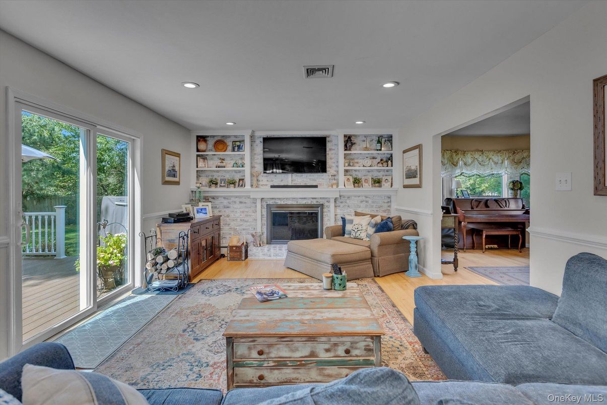 Fireplace, Interior, Living room, Piano, Recessed Lighting, Wood Texture Flooring