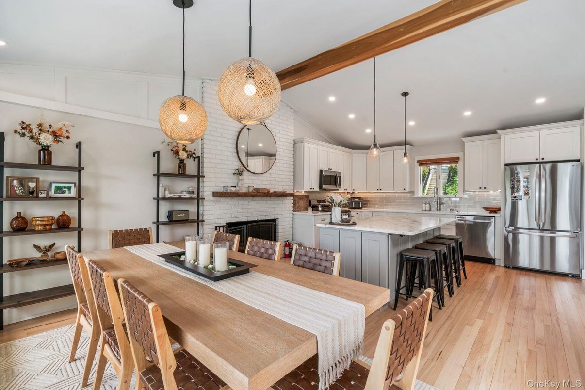 Dining room, Fireplace, Interior, Kitchen, Pendant Lights, Recessed Lighting, Stainless Steel Appliances, Stone Walls, Wood Texture Flooring