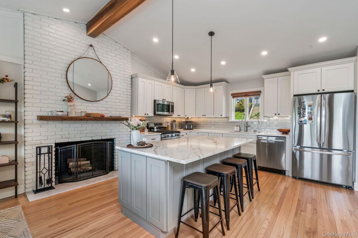 Fireplace, Interior, Kitchen, Pendant Lights, Recessed Lighting, Stainless Steel Appliances, Stone Walls, Wooden Beams, Wood Texture Flooring