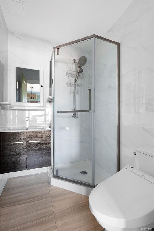 Bathroom, Glass Shower, Interior, Marble Walls, Wood Texture Flooring