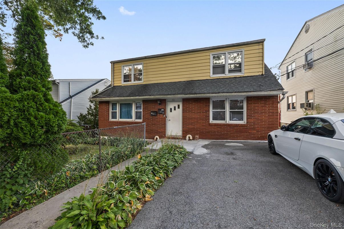 Exterior, Facade, Brick Facade, Cape Cod