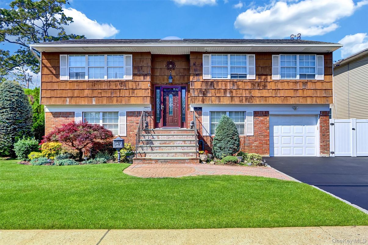 Attached, Exterior, Facade, Brick Facade, Raised Ranch