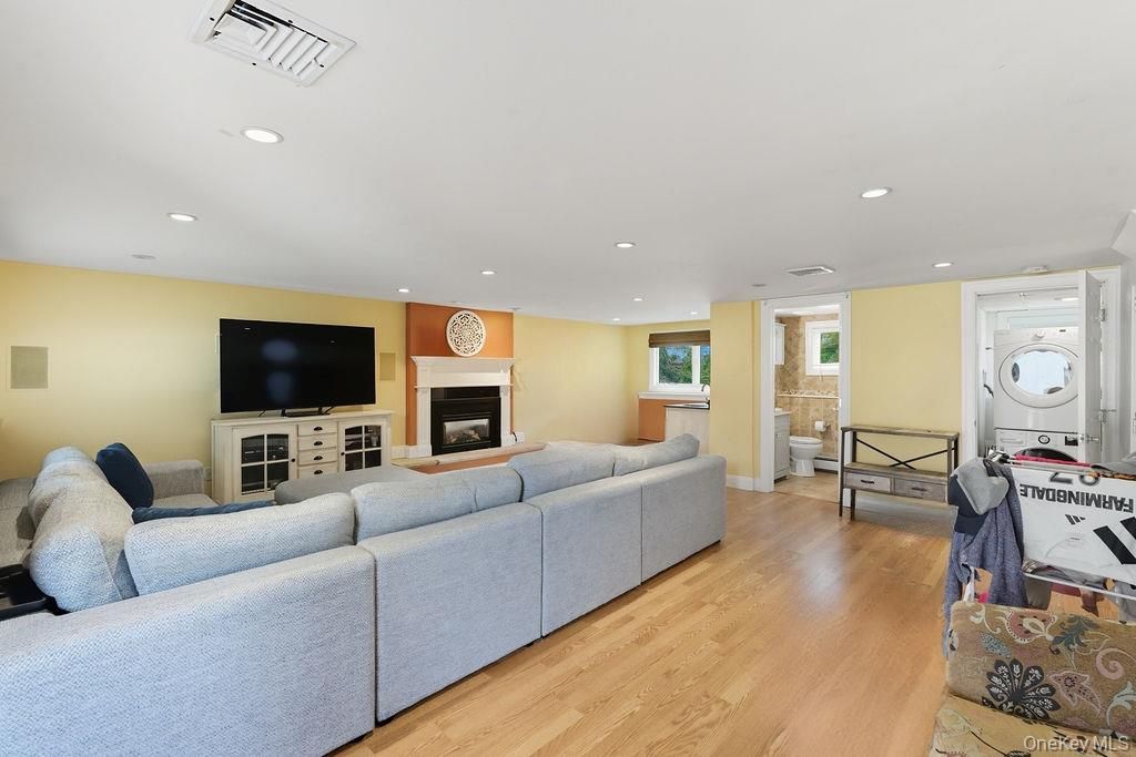Fireplace, Interior, Living room, Recessed Lighting, Washer, Wood Texture Flooring